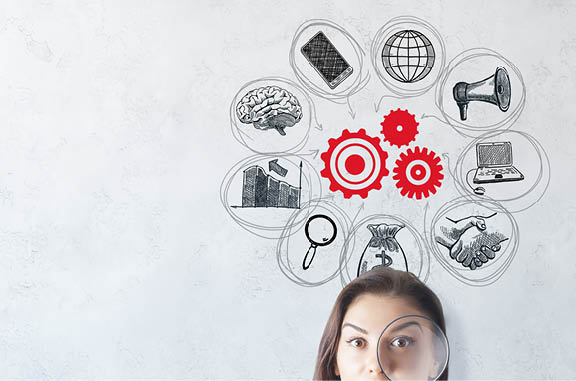 Portrait of surprised young european woman with magnifier on concrete background with business sketch  Startup and teamwork concept